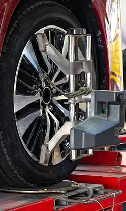 Wheel alignment, Car on stand with sensors on wheels for wheels alignment camber check in workshop of Service station.